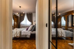 Postel nebo postele na pokoji v ubytování Deluxe Apartment RoMa