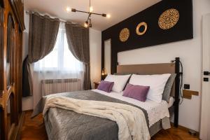 Postel nebo postele na pokoji v ubytování Deluxe Apartment RoMa