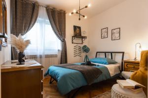 Postel nebo postele na pokoji v ubytování Deluxe Apartment RoMa