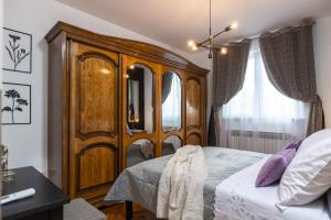 Postel nebo postele na pokoji v ubytování Deluxe Apartment RoMa
