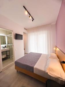 Postel nebo postele na pokoji v ubytování Le Camere Del Centro