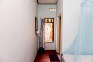 Ένα ή περισσότερα κρεβάτια σε δωμάτιο στο Raja Guest House