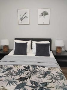 Posteľ alebo postele v izbe v ubytovaní Centrum Apartman Kőszeg
