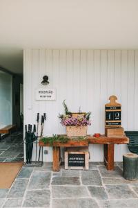 a table with flowers on it in a building at Ventozelo Hotel & Quinta in Ervedosa do Douro