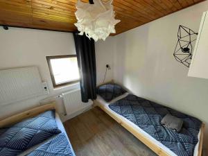 Łóżko lub łóżka w pokoju w obiekcie Chalet Gamma