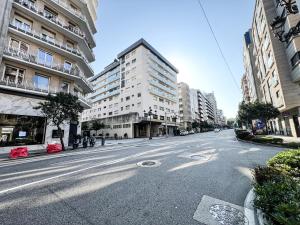 an empty street in a city with tall buildings at The Olive Loft in Vigo