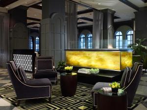 a lobby with a large screen in a building at Warwick Allerton Chicago in Chicago