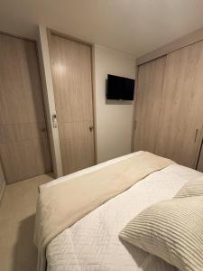 Postel nebo postele na pokoji v ubytování Apartamento La Plazuela Barranquilla + 25 fotografií