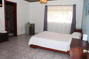 Postel nebo postele na pokoji v ubytování Hotel Samoa del Sur