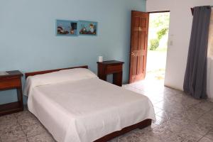 Postel nebo postele na pokoji v ubytování Hotel Samoa del Sur