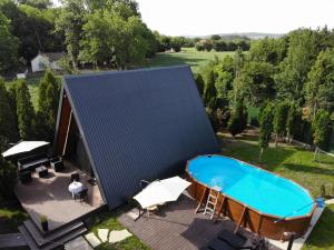 an overhead view of a house with a swimming pool at Navas River House in Poljane