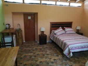 Postel nebo postele na pokoji v ubytování Elquihostel