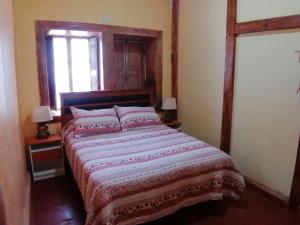 Postel nebo postele na pokoji v ubytování Elquihostel