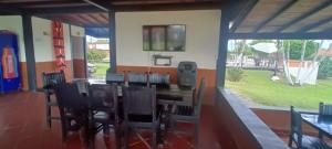 a dining room with a table and chairs at Hotel campestre manantial del Quindio in Montenegro