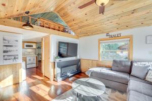 a living room with a couch and a table at 4 Mi to Ski Resort Pet-Friendly Breck Cabin in Breckenridge