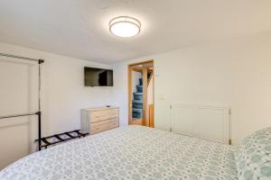 a bedroom with a bed and a dresser and a television at 4 Mi to Ski Resort Pet-Friendly Breck Cabin in Breckenridge +26 photos