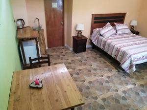 Postel nebo postele na pokoji v ubytování Elquihostel