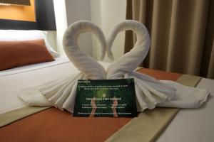 Voodi või voodid majutusasutuse Southpole Central Hotel toas