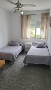 Postel nebo postele na pokoji v ubytování Alquiler