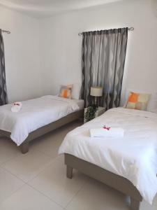 Ένα ή περισσότερα κρεβάτια σε δωμάτιο στο Tera Kora Bliss