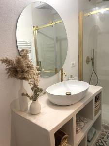 a bathroom with a white sink and a mirror at Il Castello in Seneghe +74 photos