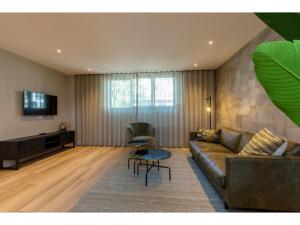 a living room with a couch and a table at Apartment in Domburg near the Beach in Domburg