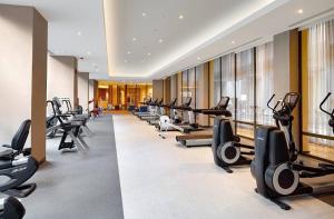 a gym with a row of treadmills and exercise bikes at My G yoo Apartment #2 in Istanbul