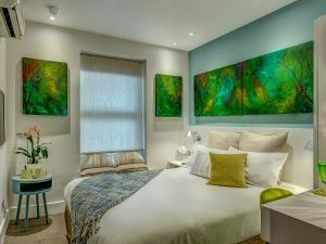 Ένα ή περισσότερα κρεβάτια σε δωμάτιο στο Hotel 55
