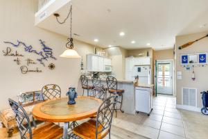 a kitchen and dining room with a table and chairs at Lakefront Camdenton Condo Near Ha Ha Tonka and Golf! in Camdenton