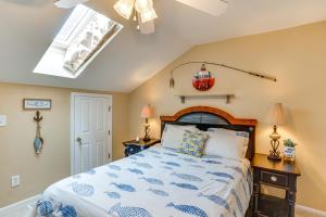 a bedroom with a bed and a skylight at Lakefront Camdenton Condo Near Ha Ha Tonka and Golf! in Camdenton +25 photos