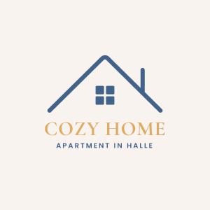 ハレにあるCozy Homeの廊下に「居心地の良い家」と書かれた家のロゴ