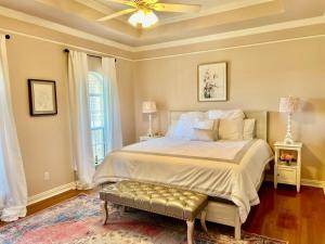 a bedroom with a bed and a ceiling fan at Stunning Country Mansion Estate in SW Fort Worth in Benbrook +95 photos