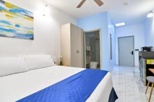 Postel nebo postele na pokoji v ubytování Apartaestudios La capital + 3 fotografie