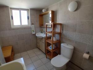 a bathroom with a toilet and a sink at Green Door 3bdr flat City Centre in Nicosia +27 photos