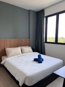 Postel nebo postele na pokoji v ubytování Santorineo Sematan 2 Bedroom Suite