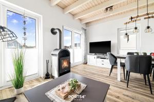 TV/trung tâm giải trí tại Lütte Diekhuus