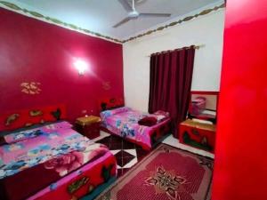 Postel nebo postele na pokoji v ubytování Nubian Paradise - Easy Check in 24 hr