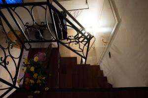 a stairway with a vase of flowers on it at Martine Dimore Storiche di Puglia in Martina Franca