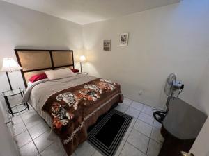Ένα ή περισσότερα κρεβάτια σε δωμάτιο στο apartament rosarito downtown B