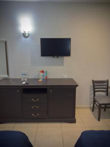 TV a/nebo společenská místnost v ubytování Hotel Maioris Kumate Culiacán