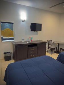 Postel nebo postele na pokoji v ubytování Hotel Maioris Kumate Culiacán