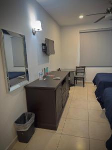 Postel nebo postele na pokoji v ubytování Hotel Maioris Kumate Culiacán