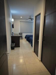Postel nebo postele na pokoji v ubytování Hotel Maioris Kumate Culiacán