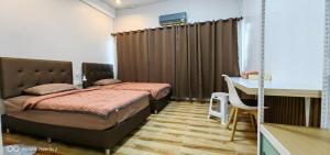 สิริธิราเพลส Sirithira Place客房内的一张或多张床位