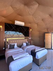 Ένα ή περισσότερα κρεβάτια σε δωμάτιο στο WADI RuM GRAND +93 φωτογραφίες