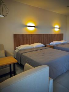Postel nebo postele na pokoji v ubytování Hotel Maioris Kumate Culiacán