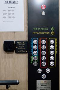 a sign for a hotel room with a sign for a hotel register at 291 on King in Newcastle +11 photos
