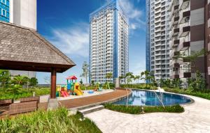 a playground in a city with tall buildings at Delipark Mall 2 Bedrooms 1 Bathroom 4-6 Pax Liberty Tower Level 9 in Medan