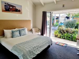 Postel nebo postele na pokoji v ubytování Southpacific Motel + 37 fotografií