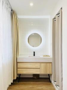 a bathroom with a sink and a mirror at WillsChengduCenter in Chengdu